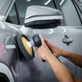 Bomar oligomers for abrasion resistance, person buffing, sanding a car door