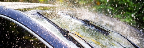 Oligomers for Weatherability, Car Windshield Shown In The Rain