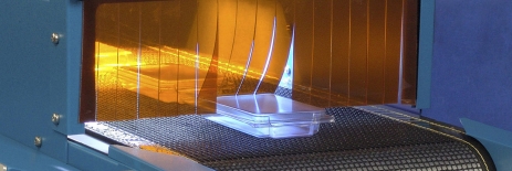 Fast Curing Oligomers, Clear Plastic Material Being Cured In A Light Cure Conveyor